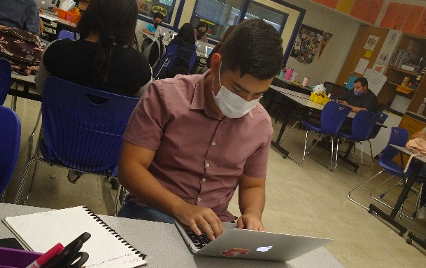 A Bowie High School student focuses in class.